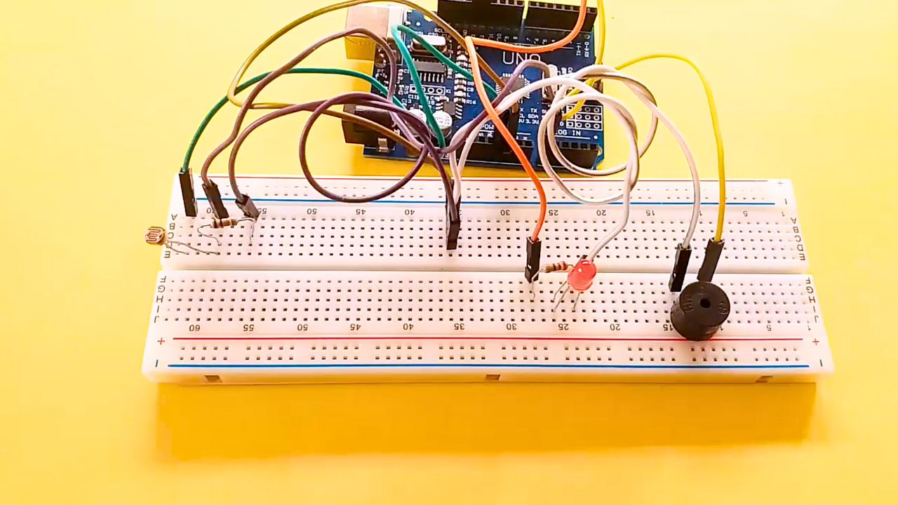 Activate Buzzer and LED Using LDR and Arduino – Light Alarm System Project